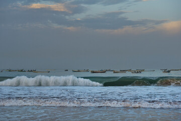 West Africa. Mauritania. Twilight waves of the Atlantic Ocean on the shore of a fishing village.