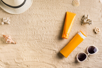 Fototapeta na wymiar Sunscreen sunblock lotion on sandy beach