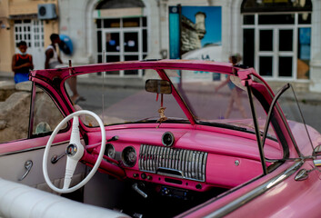 Retro car details on a city street. American cars in Cuba