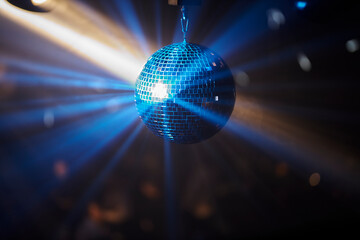 disco ball. disco ball background close up. Party disco mirror ball reflecting blue color lights 