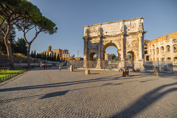 Fototapeta na wymiar View on Arch of Constantine near Colosseum in Rome. Traveling Italian landmarks concept. Idea of tourist places and attractions