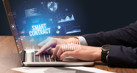 Businessman working on laptop, business concept