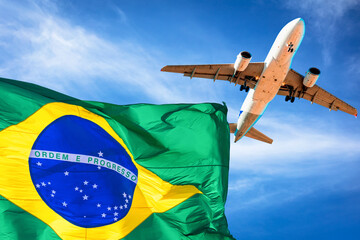 Brazil flag and plane with blue sky in the background.
