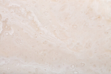 Background Stone wall, background with abstract stains of epoxy resin. Beautiful texture of marble and granite with stains, onyx surface. Finishing stone for furniture and interior. Acrylic stains