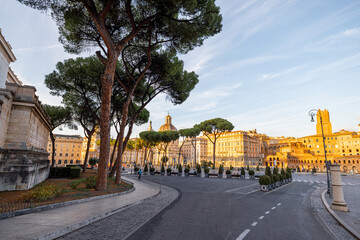 Scenic view on buildings and main road near Roman Forum at sunset. Concept of historical landmarks and travel Italy