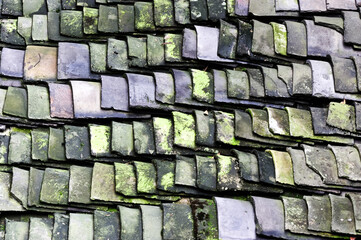  old and ruined roofs. The texture of a roof with old roof tiles
