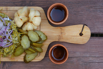 Assorted pickled vegetables. pickled cucumbers, green tomatoes, green peppers, garlic, etc.
