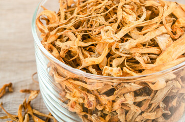 Dried cordyceps militaris mushroom flower on wooden background.