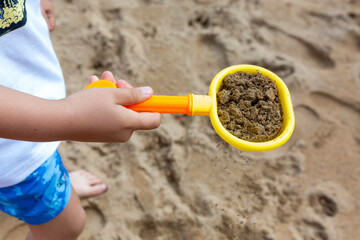 child playing with sand