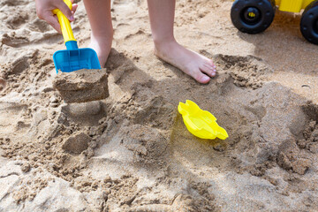 child playing with sand