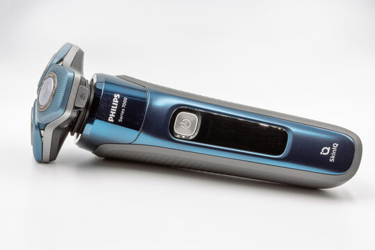 Modern Philips electric shaver 7000 series closeup against white.