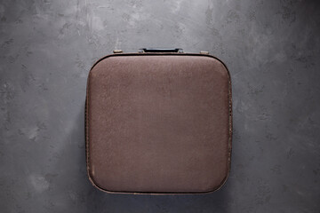 Old suitcase on floor background texture. Travel concept idea