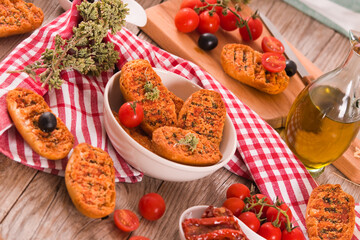 Toasted bread with tomato and oregano.