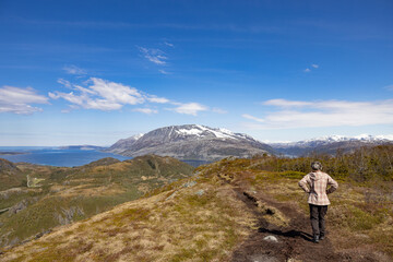 Fototapeta na wymiar Happy woman hiking in Gåsheia mountains,Northern Norway,scandinavia,Europe