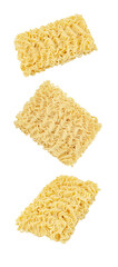 Instant noodles, raw briquettes, three pieces,  isolated on white background, falling, hanging, flying, soaring.
