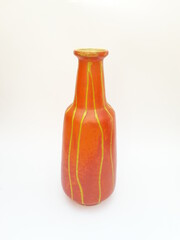 Mid-century modern pottery - orange vase with yellow stripes