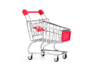 Empty grocery toy shopping cart with red handle isolated on white background, suitable for marketing and shopping product advertisement.