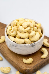Cashew nuts isolated on white background. Organic nuts. close up