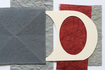 paper with texture and stencil with ovals (partly covered)