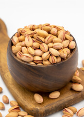 Pistachio nuts isolated on white background. Organic nuts. close up