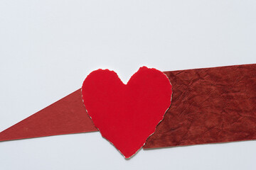 red heart on a white background (with other paper shapes)