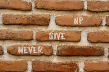 Never give up and support symbol. Concept words Never give up on brick wall. Beautiful brick wall...