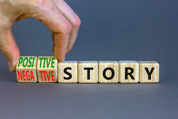 Positive or negative story symbol. Businessman turns cubes, changes concept words Negative story to Positive story. Beautiful grey background. Business positive or negative story concept. Copy space.