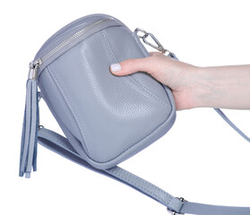 Female gray small bag in hand on white background isolation