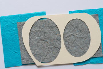 paper stencil over paper shapes