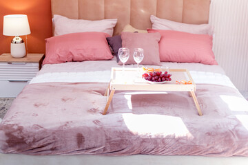 bedroom interior in pink and lilac tones