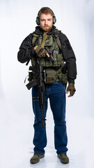 an airsoft player in full gear pointed the muzzle of a pistol at the target. a man in an outfit, in headphones, a bulletproof vest, with a backpack and a belt with additional shells. white background.