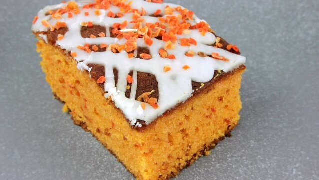 a piece of sweet carrot pie dessert rotates 360 degrees on a karmic surface