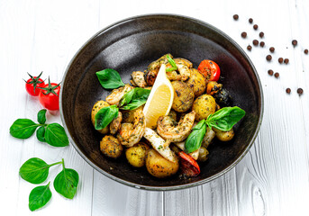Mix of fresh seafood, squid, shrimp, mussels and clams accompanied by salad and country style fries