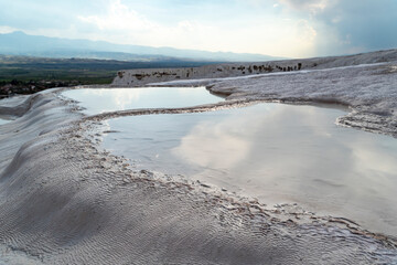 Pamukkale thermal nath pools in travertines at sunset