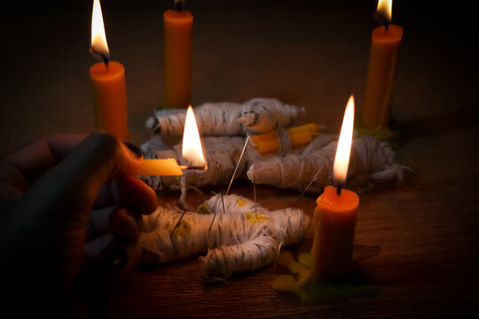 Candle light in the dark and curse doll