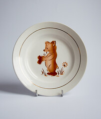 Vintage porcelain bowl with teddy bear pattern