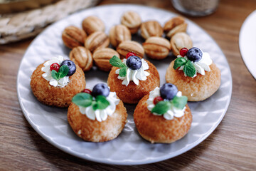 Sweet pastries with custard and berries