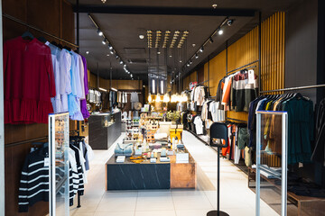 Interior of a brand new fashion clothing store. Panorama, Vilnius, Lithuania 10 April 2022