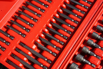 Set of tool bits for screwdriver tool bit tool in a red toolset box 