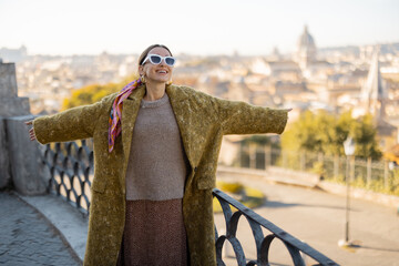 Woman enjoying beautiful morning cityscape of Rome, walking in Villa Borghese Park. Old fashioned...