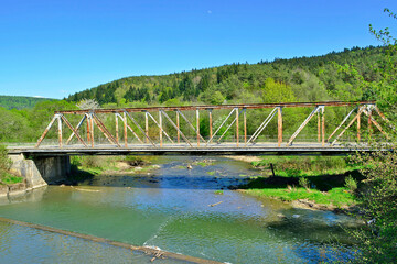 Obraz premium The rusty old bridge in Krempna, Low Beskids (Beskid Niski), Poland