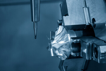 Close up scene the  4-axis  machining center cutting the turbocharger parts with solid ball end mill tool.