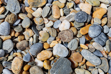 Sea stone pebble background. Abstract nature background with pebble stones. Full frame shot of multicolored pebbles. Close-up. Top view