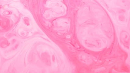 Light pink fluid art background. Blurred pink shapes on a liquid surface. Abstract wallpaper of soft pink shades