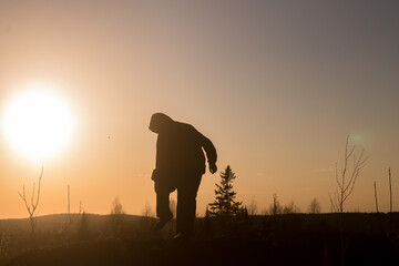 silhouette of a person in the sunset