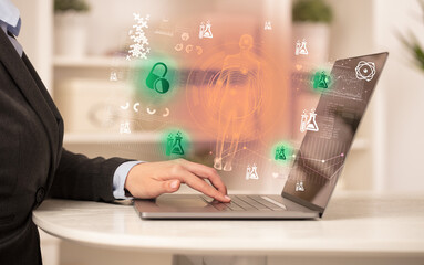 Doctor working on laptop with healthcare concept