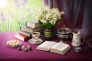 Still life from ancient book and lush boquet