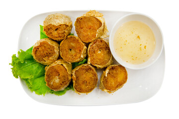 Top view of Deep Fried Crab Meat Rolls with sweet sauce, focus selective