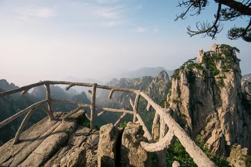 Papier Peint photo autocollant Monts Huang View Point with Stone Fence and Pine Tree in Huangshan Yellow Mountains, Anhui Province, China