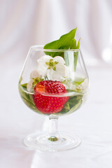 Red strawberries in a glass. Harvesting berries